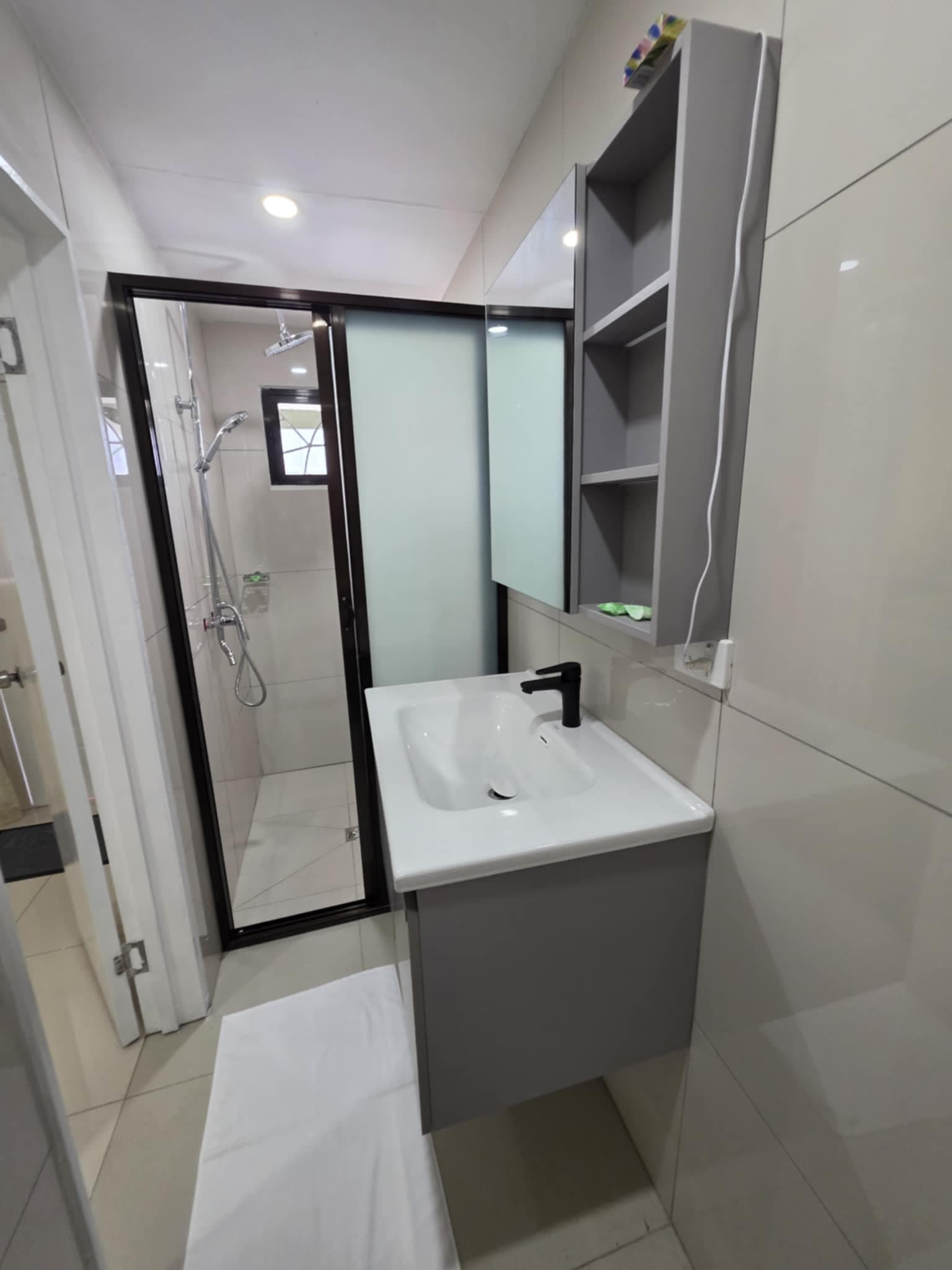 Studio bathroom with glass walk-in shower